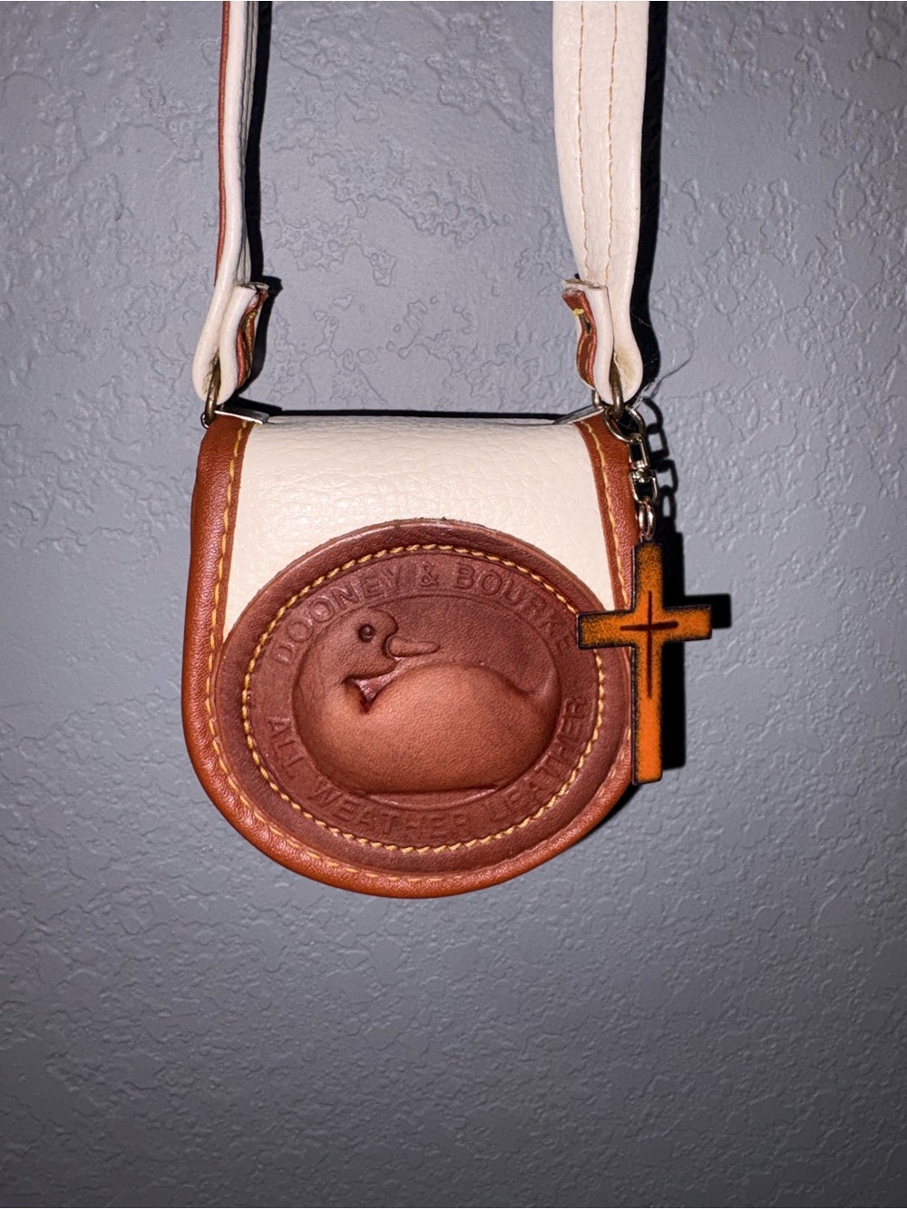 Dooney & Bourke Cream and Brown Mini Crossbody with Cross Charm